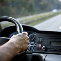 Man holding steering wheel